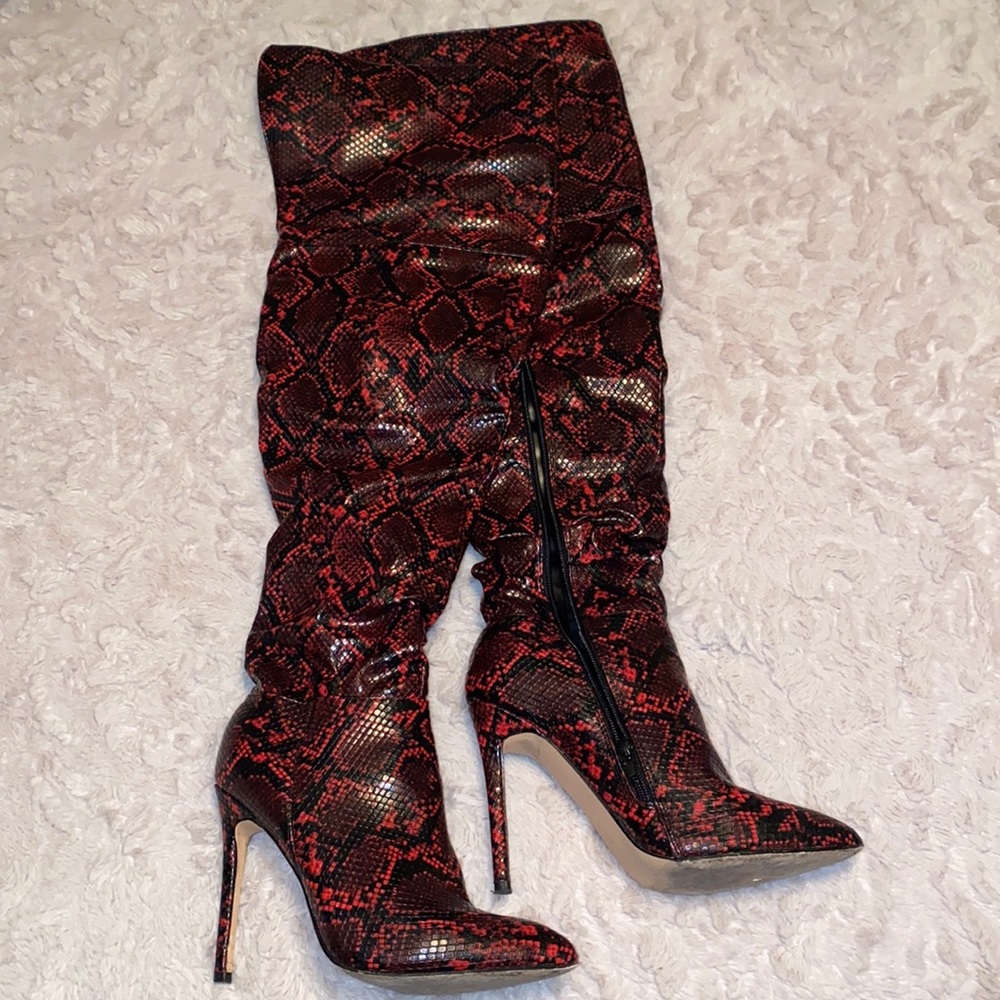 Over the knee snakeskin boots